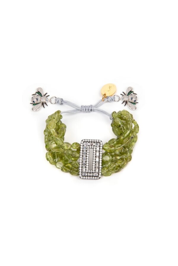 Multiple strings of glittering natural peridot gemstones cluster around a crystal encrusted angular centerpiece with a vintage finish in 925 sterling silver. Handmade and delicately tied