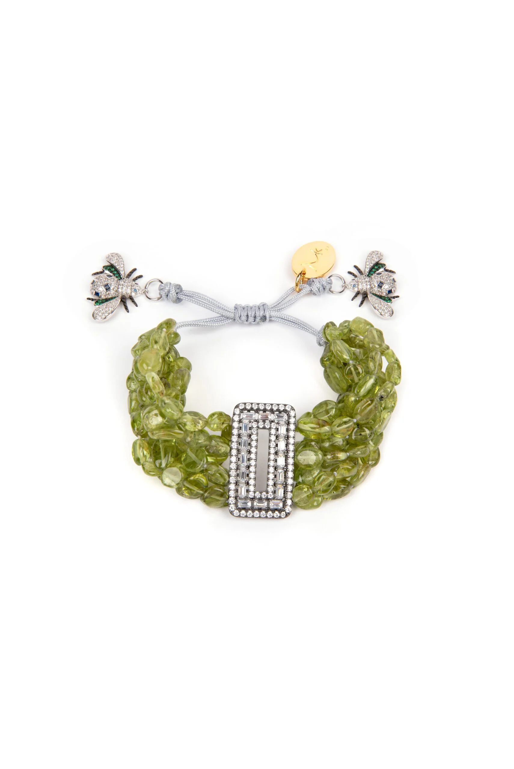 Product-shot-scaled-1.jpg Multiple strings of glittering natural peridot gemstones cluster around a crystal encrusted angular centerpiece with a vintage finish in 925 sterling silver. Handmade and delicately tied